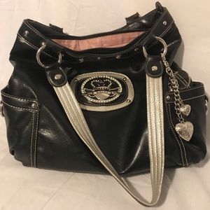 Kathy Van Zeeland faux leather bag with charms